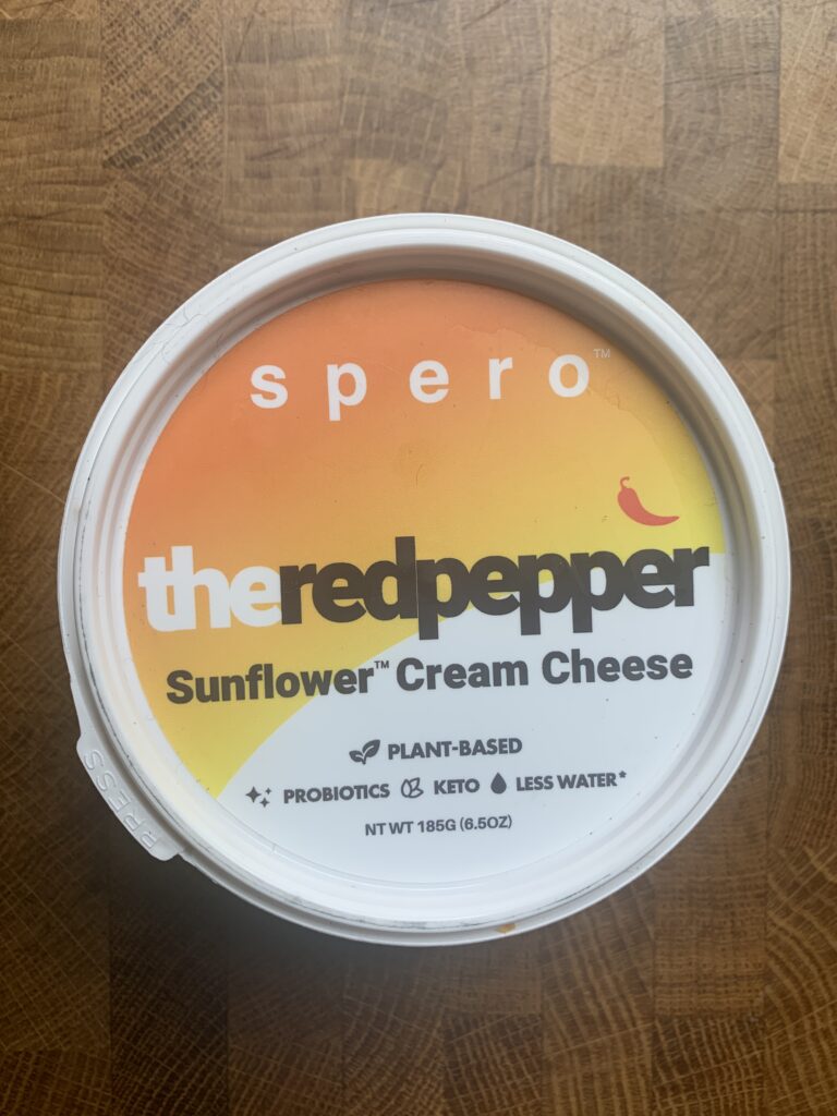A container of Spero sunflower cream cheese red pepper flavor. 