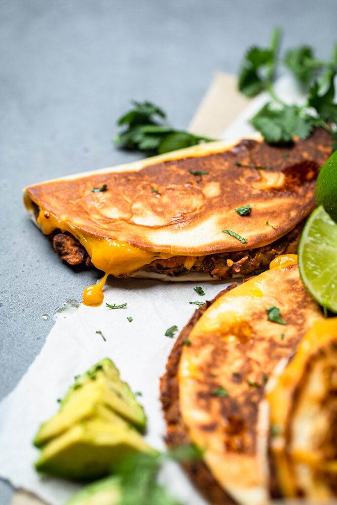An easy cheesy crispy vegan black bean taco with perfectly golden brown crust texture.
